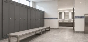 Modern commercial changing area with benches, lockers and clear circulation space.